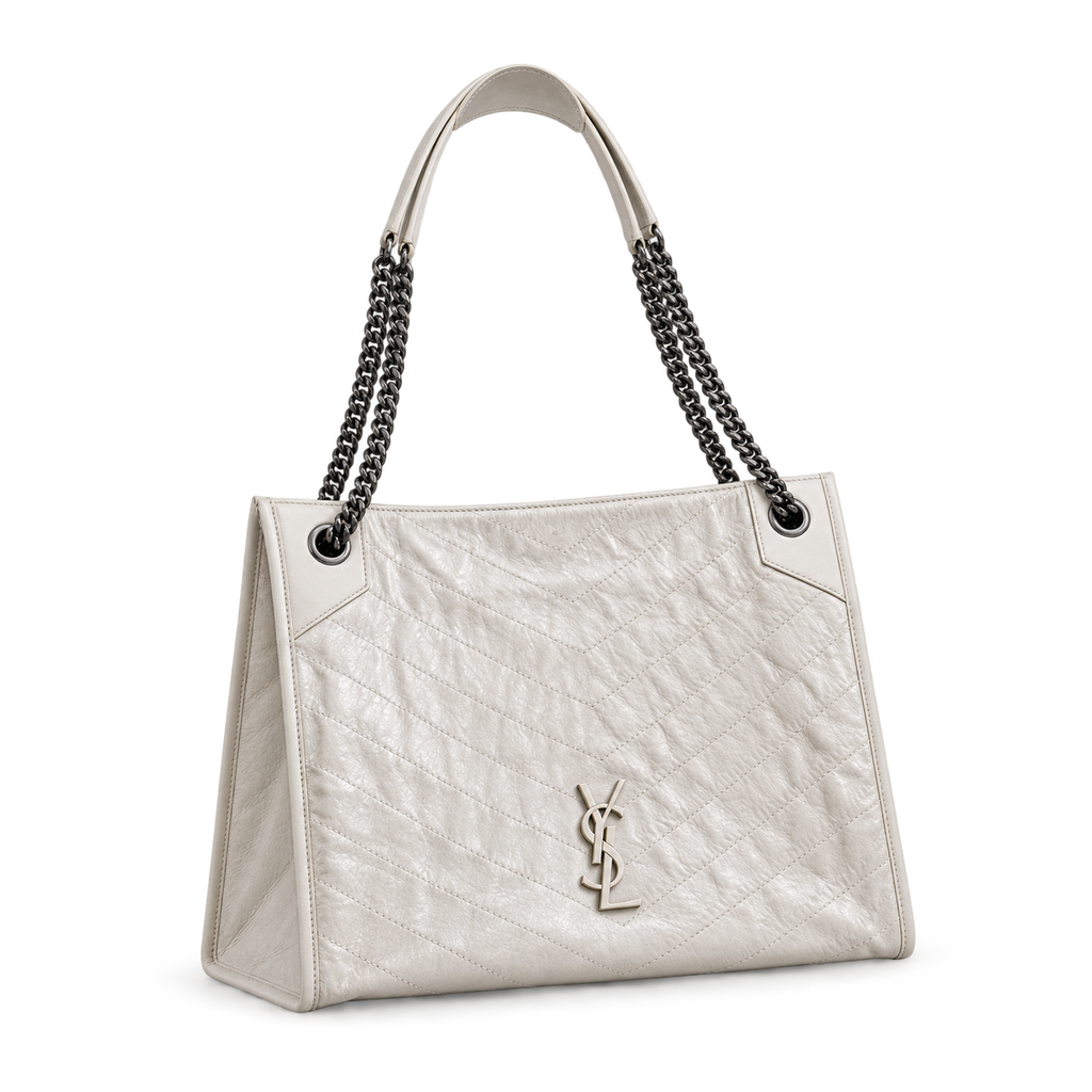 YSL Niki Shopping Bag in white chevron-quilted crinkled leather with dual silver chain straps and silver YSL monogram, side angle view